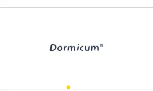 Niebieski napis "Dormicum" na białym tle, z żółtą kropką na dole.